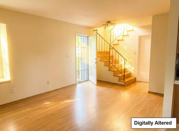 a view of an entryway with wooden floor