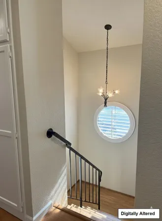 a view of a hallway with a chandelier