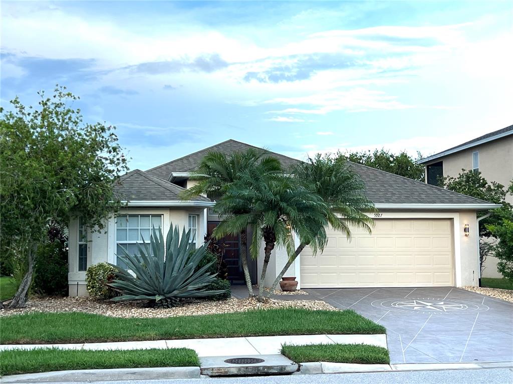 5927 Willows Bridge Loop Ellenton, FL 34222 - Photo 1 of 1 a front view of a house with a garden and yard