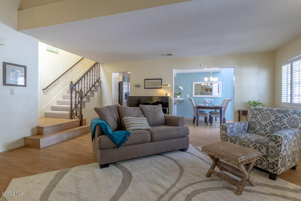 1920 Rory Lane, Unit 4 Simi Valley, CA 93063 - Photo 1 of 24 a living room with furniture and a fireplace