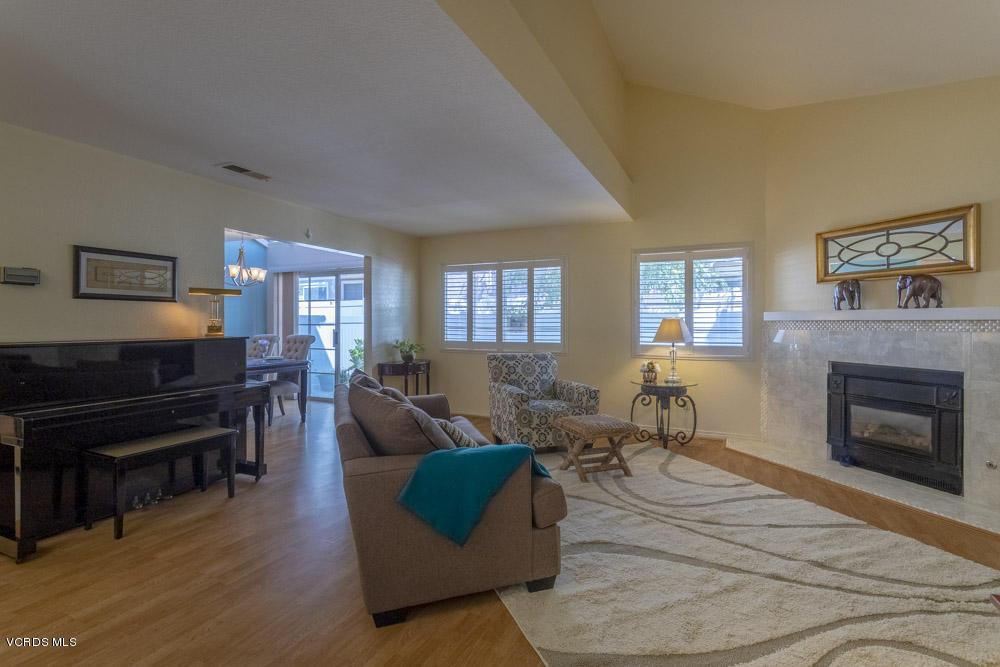 1920 Rory Lane, Unit 4 Simi Valley, CA 93063 - Photo 2 of 24 a living room with furniture fireplace and a piano
