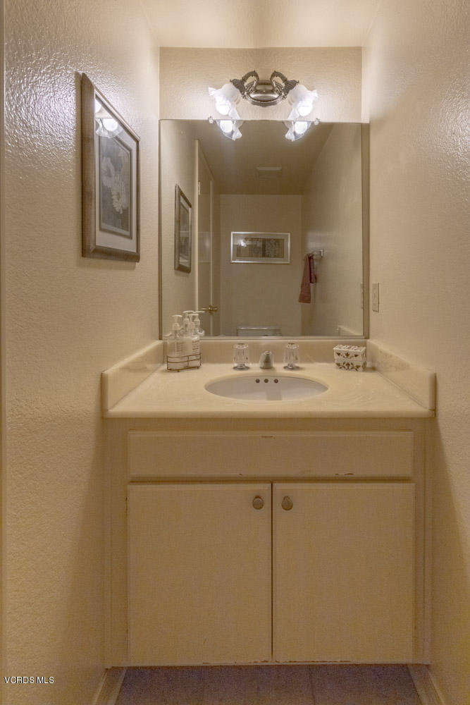 1920 Rory Lane, Unit 4 Simi Valley, CA 93063 - Photo 12 of 24 a bathroom with a sink and a mirror