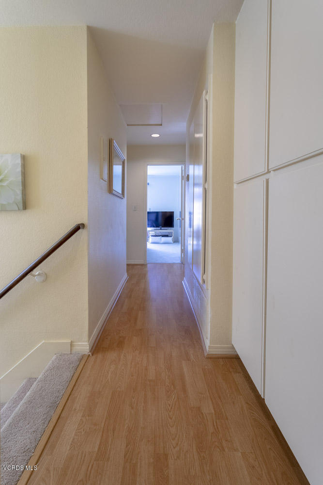 1920 Rory Lane, Unit 4 Simi Valley, CA 93063 - Photo 13 of 24 a view of a hallway view with wooden floor and staircase