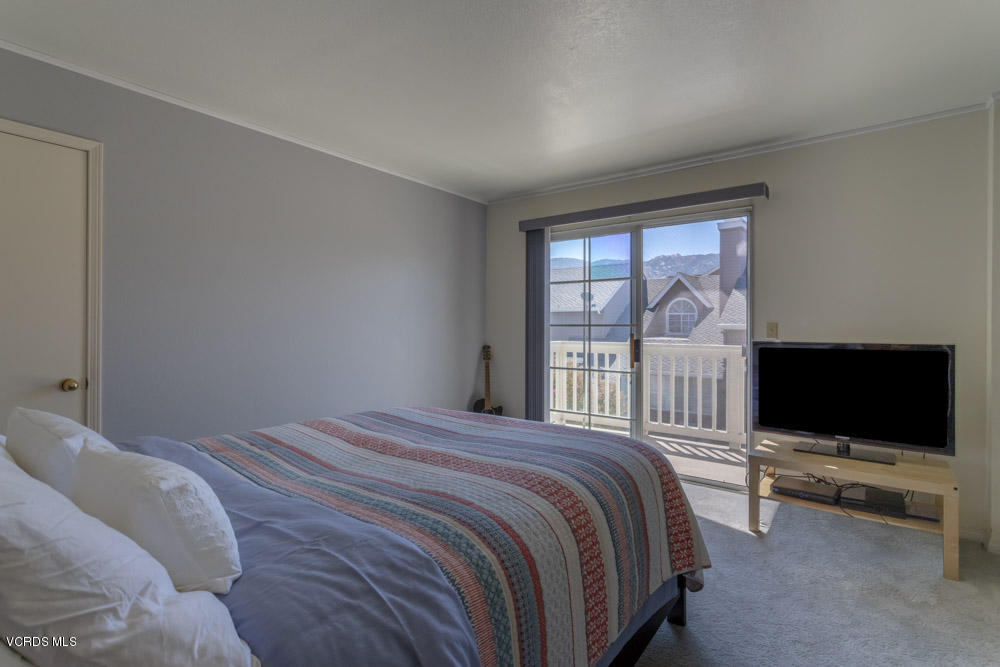 1920 Rory Lane, Unit 4 Simi Valley, CA 93063 - Photo 18 of 24 a bedroom with a bed and a flat screen tv