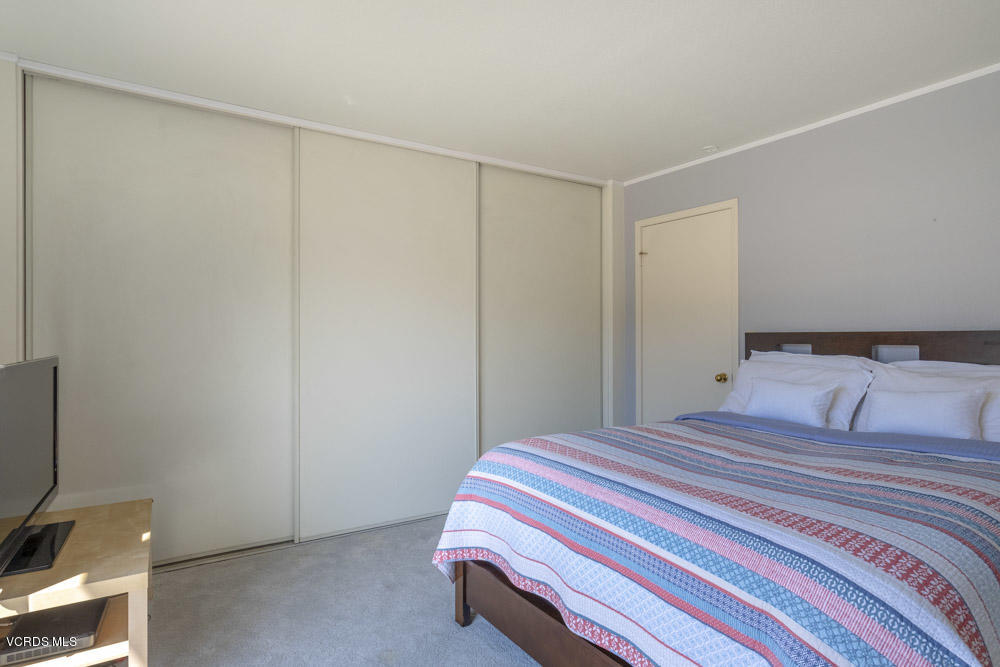 1920 Rory Lane, Unit 4 Simi Valley, CA 93063 - Photo 19 of 24 a bedroom with a bed and a tv