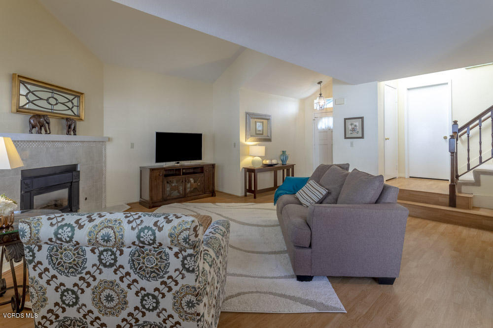 1920 Rory Lane, Unit 4 Simi Valley, CA 93063 - Photo 3 of 24 a living room with a couch and a flat screen tv