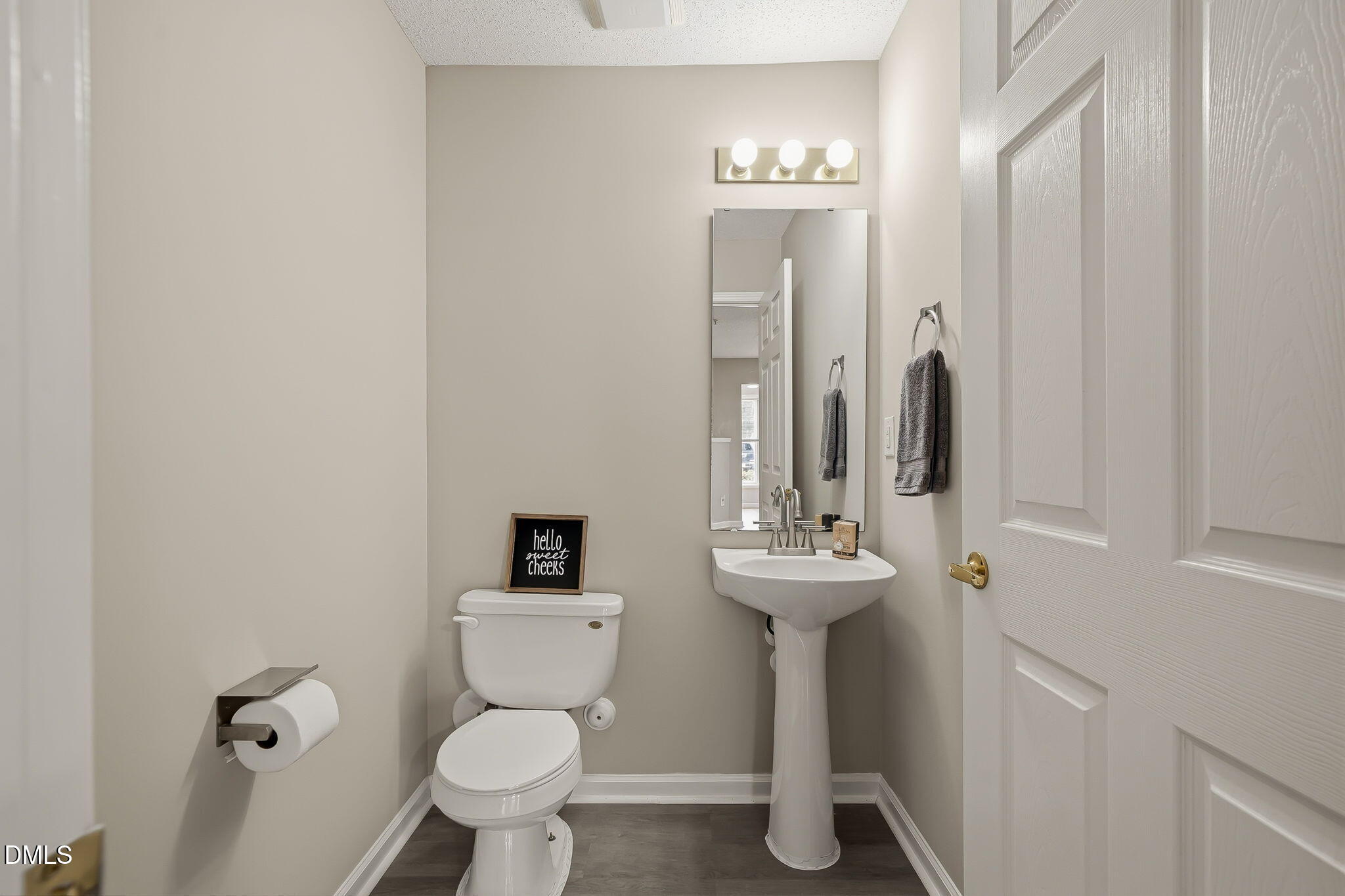 2501 Huntscroft Lane, Unit 100 Raleigh, NC 27617 - Photo 22 of 31 a bathroom with a toilet sink and mirror