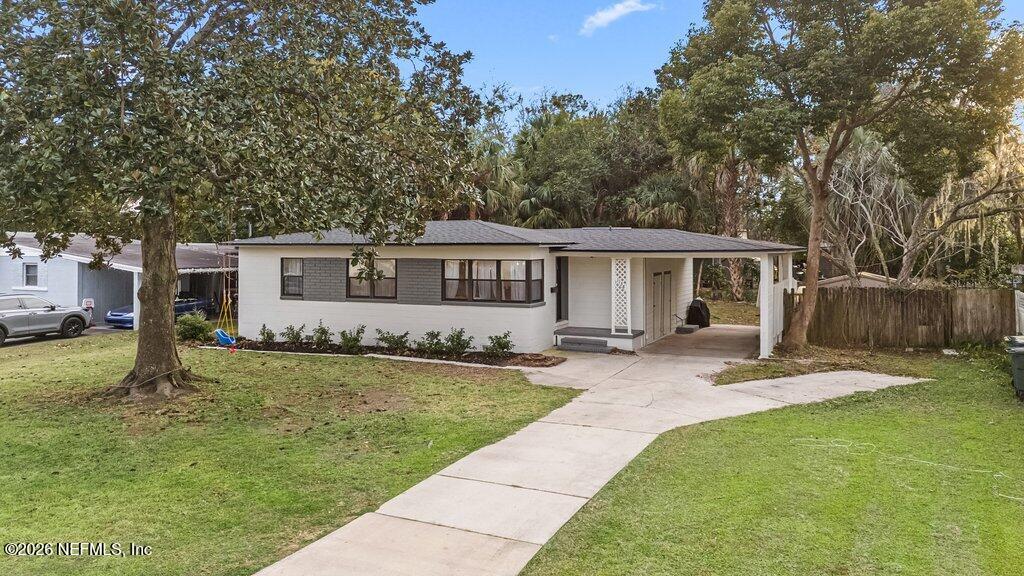 1138 Halifax Road Jacksonville, FL 32216 - Photo 2 of 34 a view of a house with a yard and sitting area