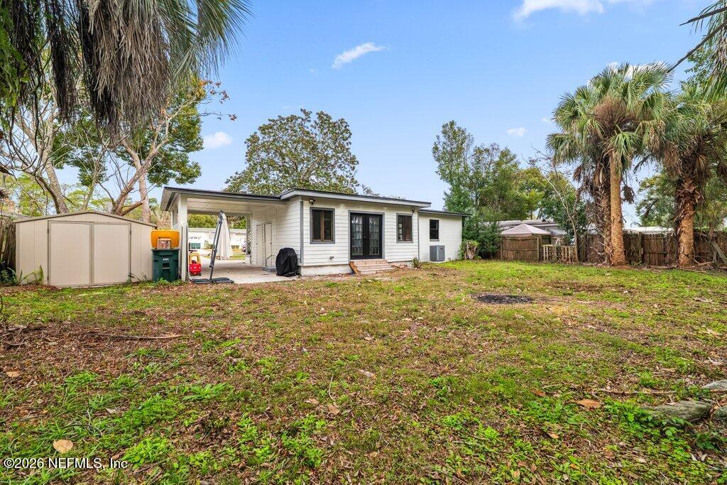 1138 Halifax Road Jacksonville, FL 32216 - Photo 26 of 34 a front view of house with yard and trees