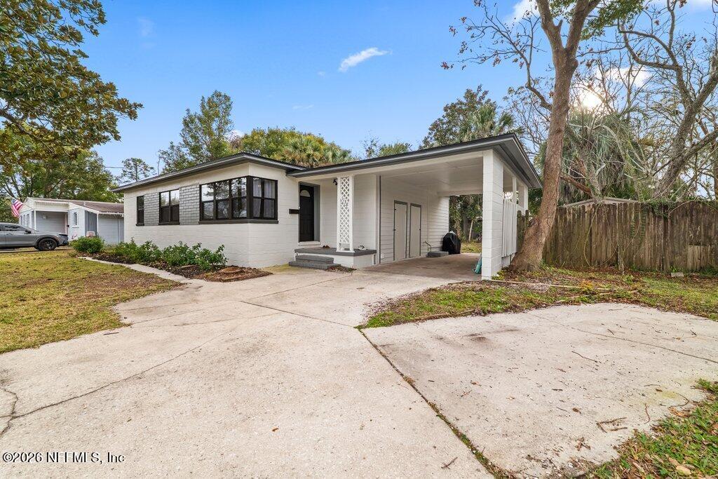 1138 Halifax Road Jacksonville, FL 32216 - Photo 31 of 34 a front view of a house with a yard