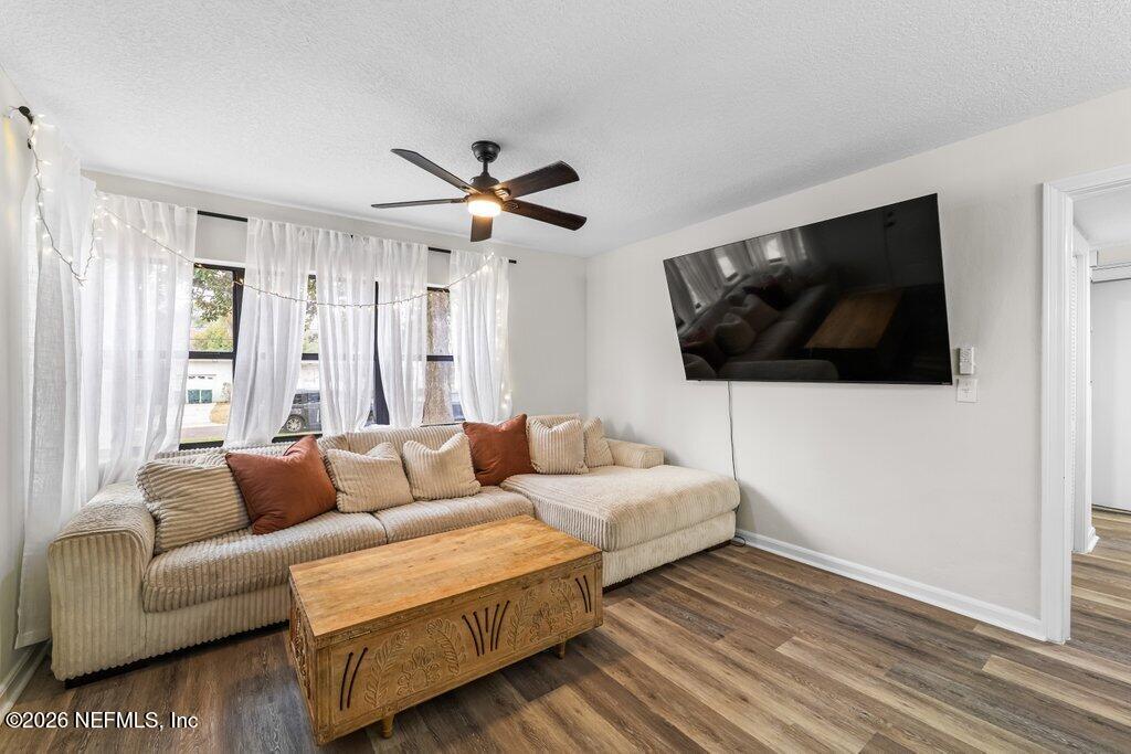 1138 Halifax Road Jacksonville, FL 32216 - Photo 6 of 34 a living room with couch a flat screen tv and a window