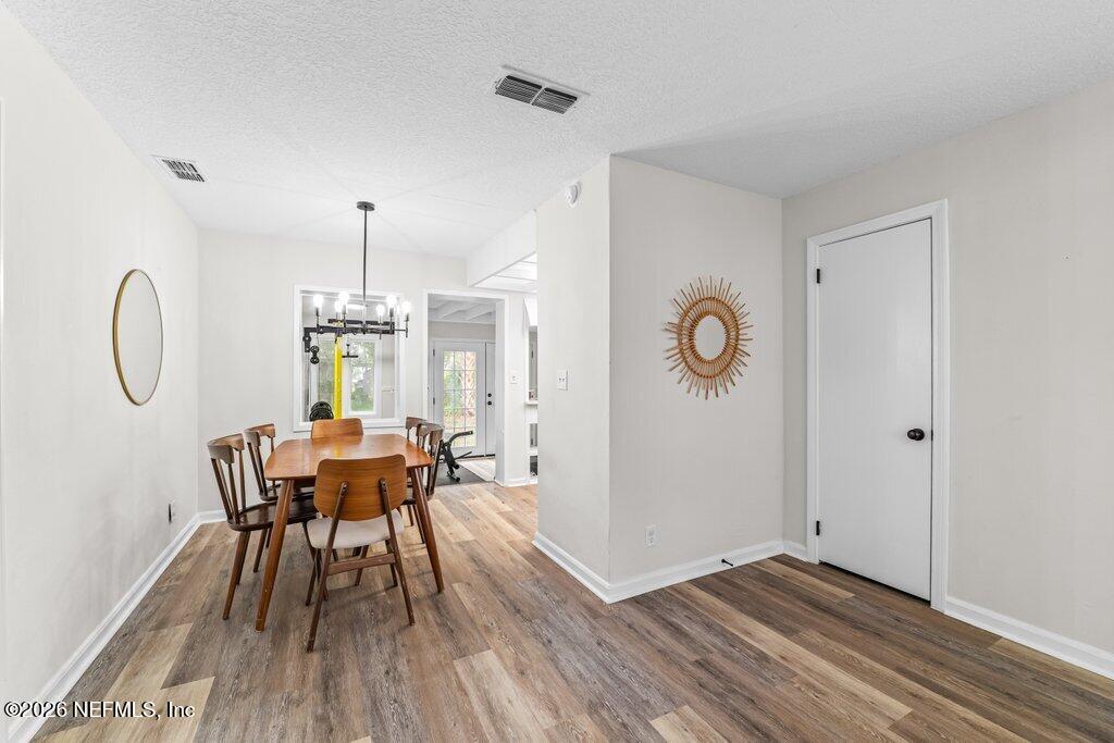 1138 Halifax Road Jacksonville, FL 32216 - Photo 7 of 34 a view of a dining room with furniture window and wooden floor