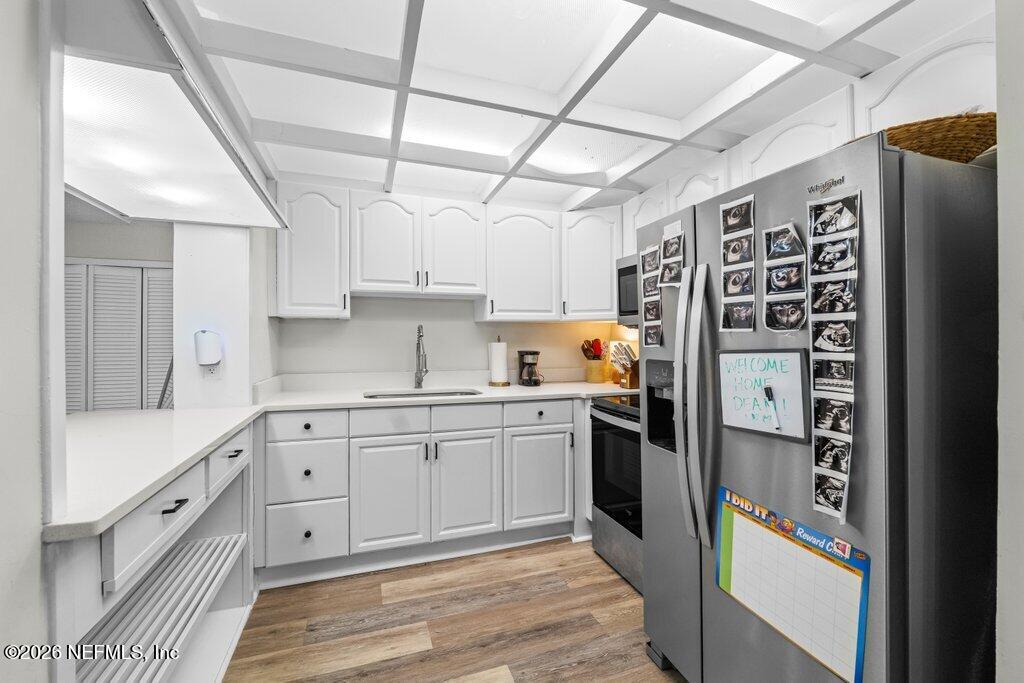 1138 Halifax Road Jacksonville, FL 32216 - Photo 9 of 34 a kitchen with stainless steel appliances granite countertop a refrigerator and a stove top oven