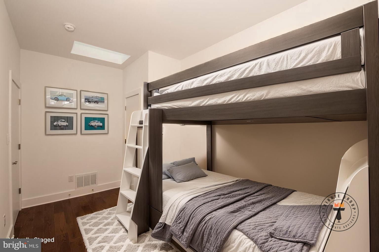 1956 North 8th Street, Unit 2 Philadelphia, PA 19122 - Photo 20 of 23 a bedroom with a bed and wooden floor