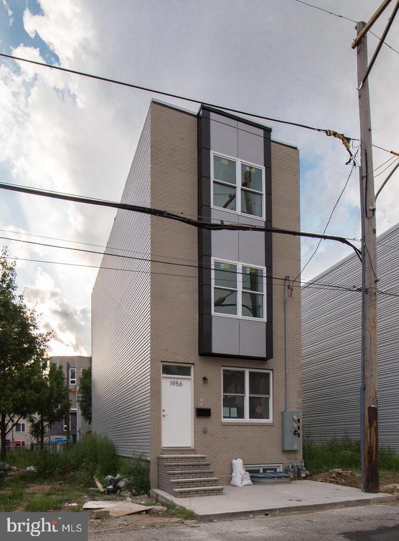 1956 North 8th Street, Unit 2 Philadelphia, PA 19122 - Photo 2 of 23 a front view of a multi story building