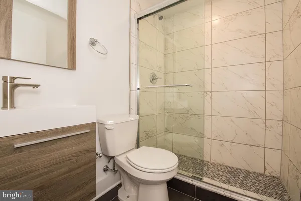 a bathroom with a toilet and a sink