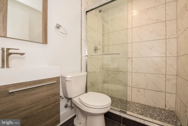 a bathroom with a toilet and a sink