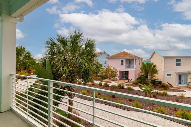 a view of a chair and table in the balcony