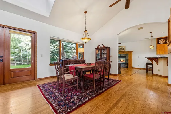 a view of a dining room with furniture window and wooden floor