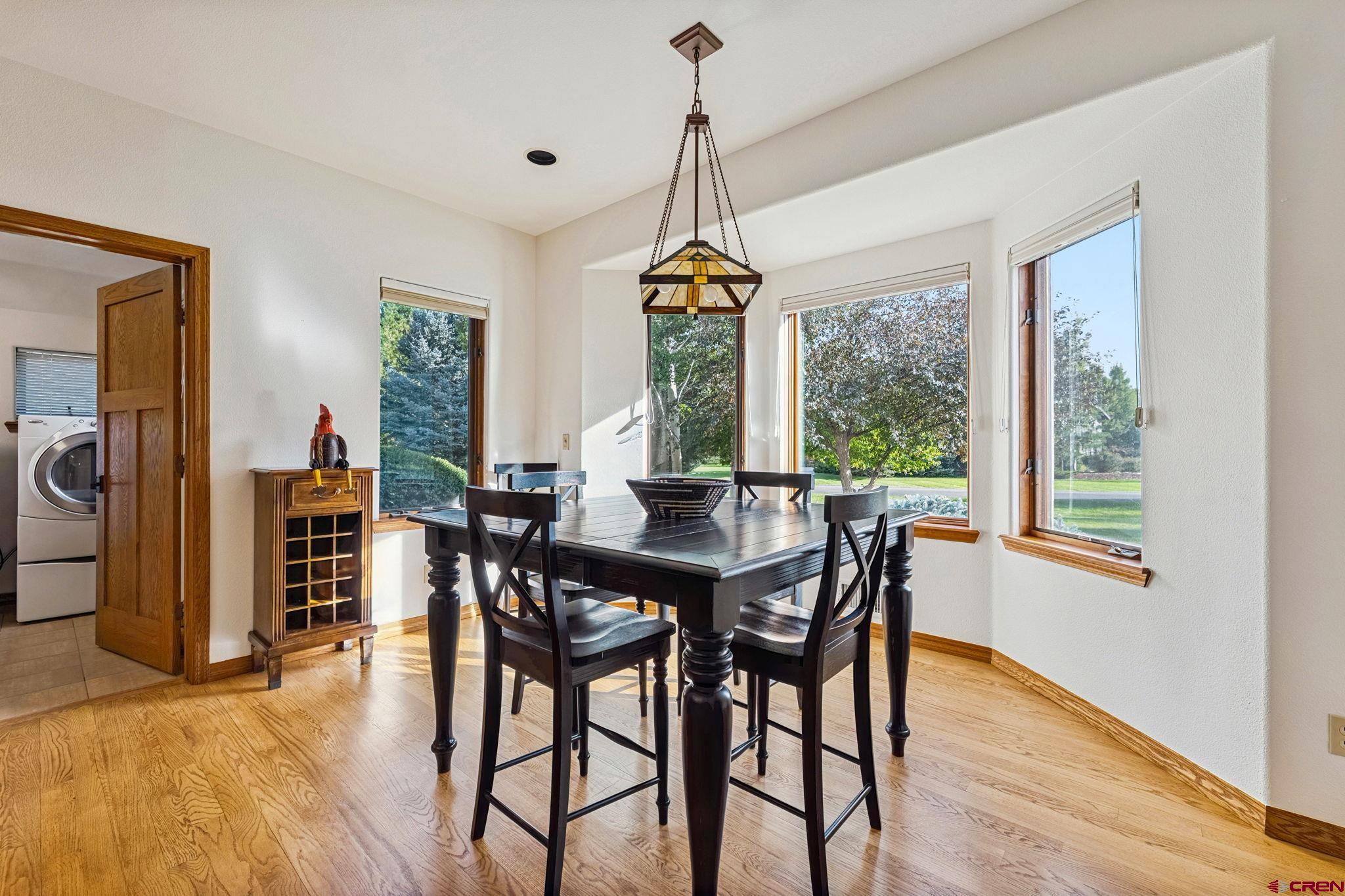 345 Red Rock Road Durango, CO 81301 - Photo 15 of 44 a dining room with furniture window wooden floor