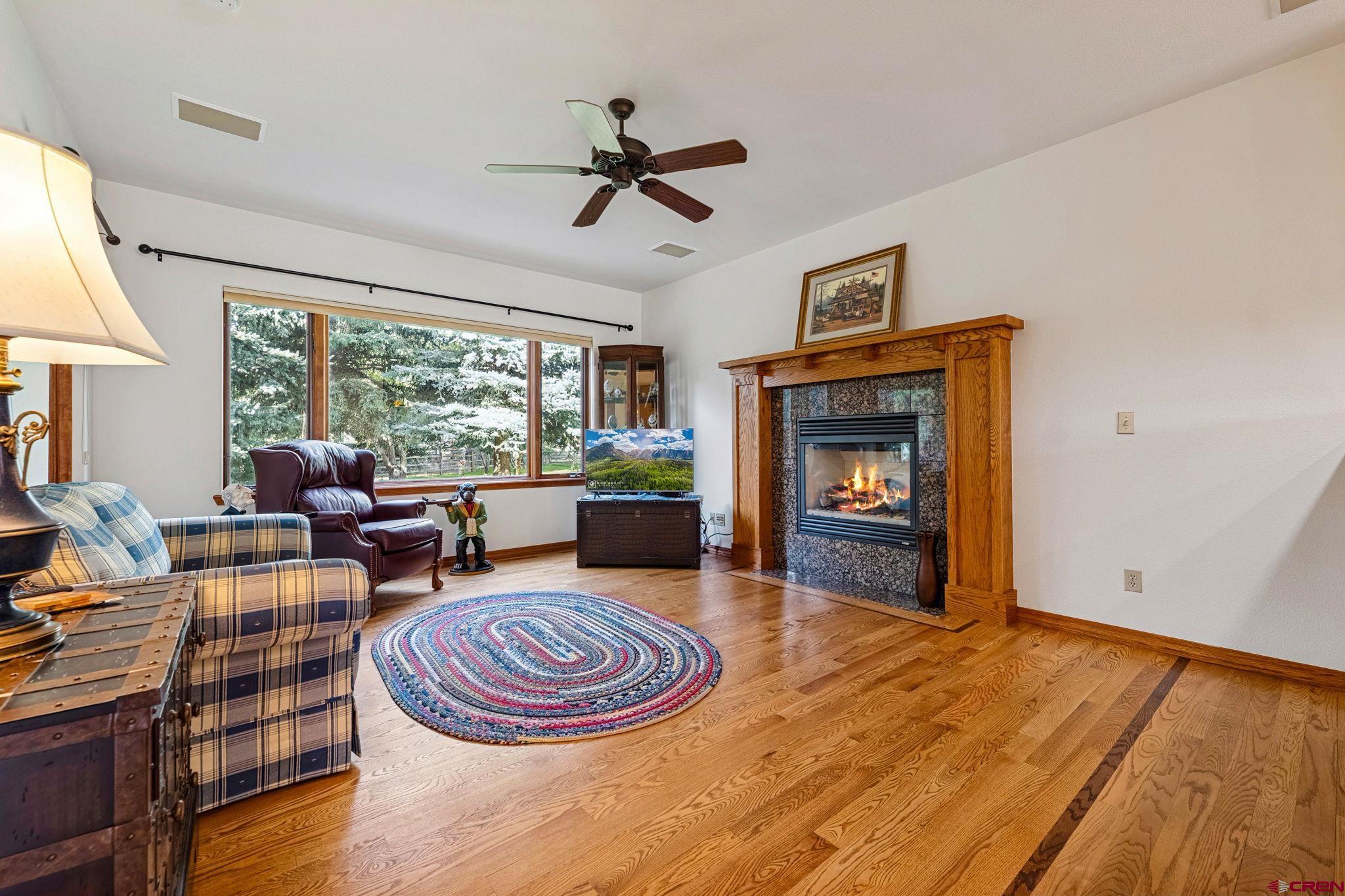 345 Red Rock Road Durango, CO 81301 - Photo 16 of 44 a living room with furniture and a fireplace