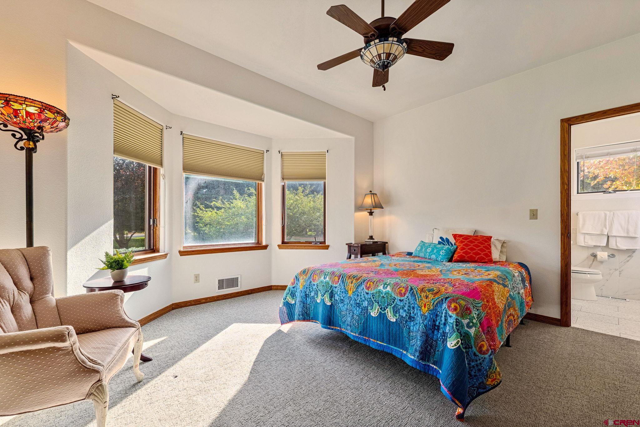 345 Red Rock Road Durango, CO 81301 - Photo 25 of 44 a bedroom with a bed and a couch