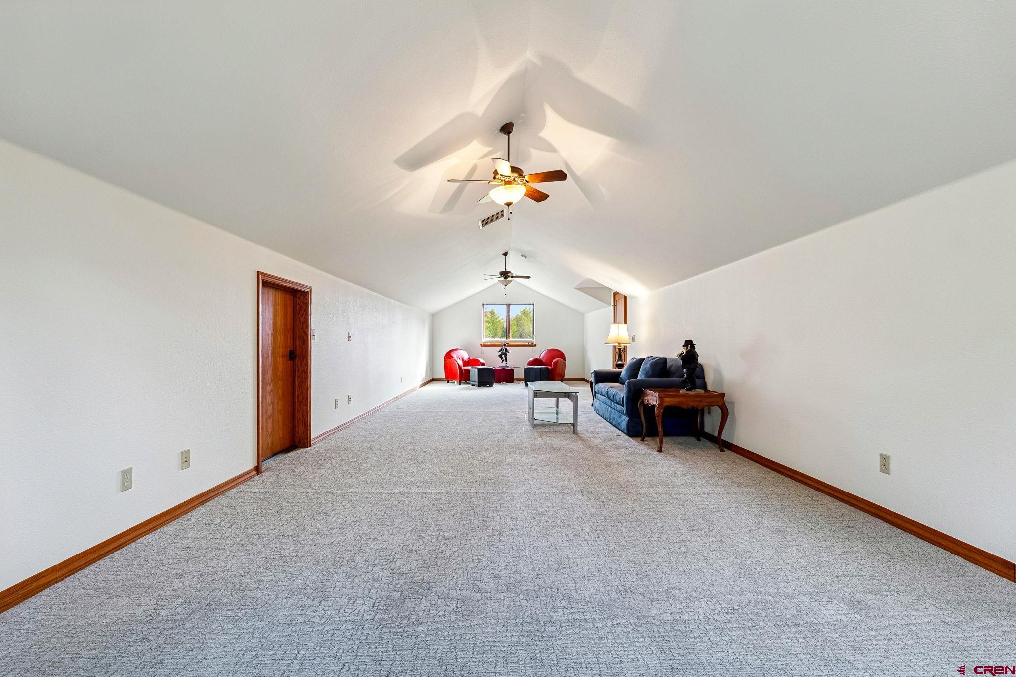345 Red Rock Road Durango, CO 81301 - Photo 31 of 44 a living room with furniture and a chandelier