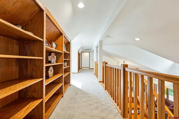 a view of walk in closet with wooden floor