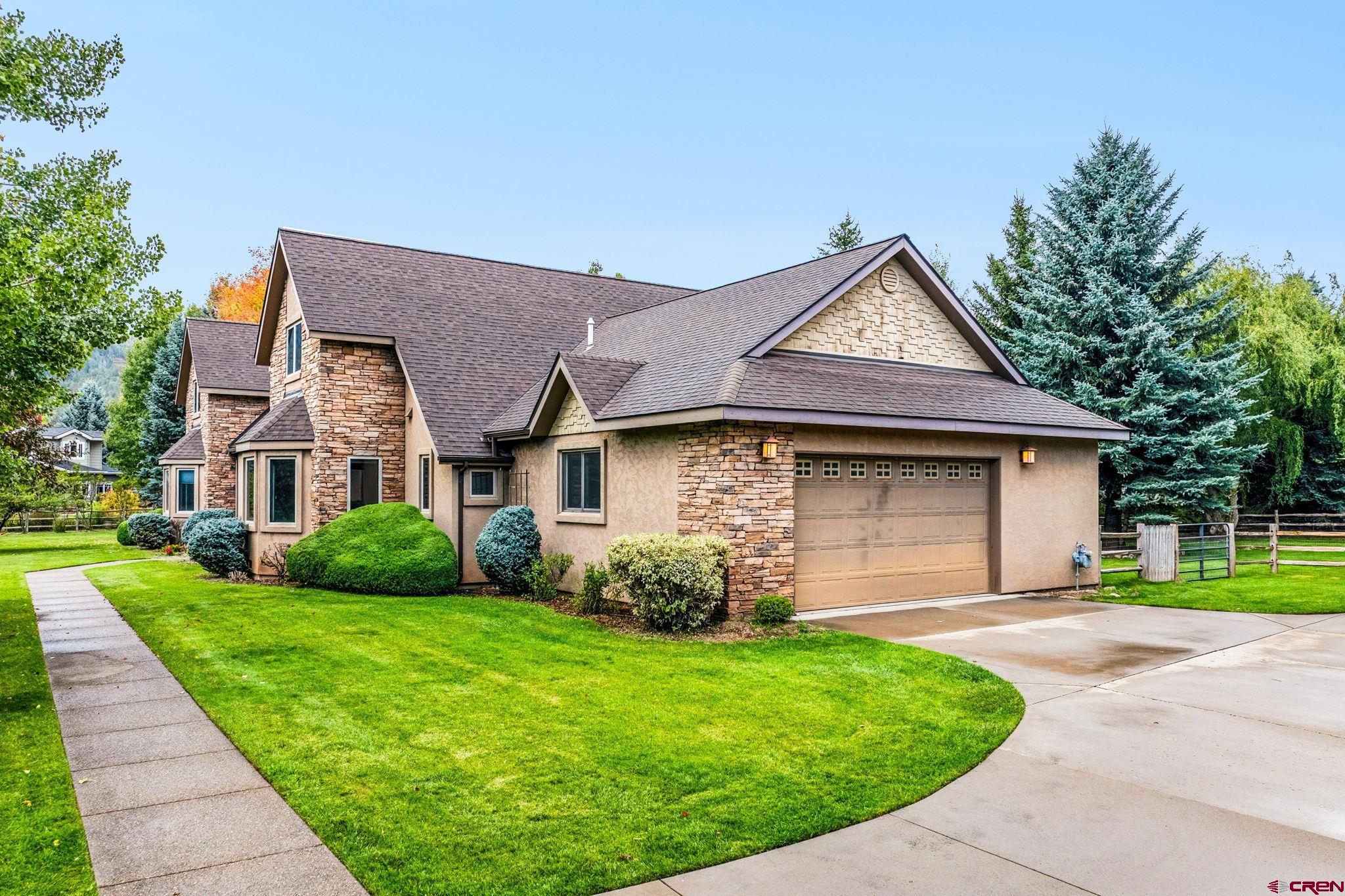 345 Red Rock Road Durango, CO 81301 - Photo 35 of 44 a front view of a house with garden