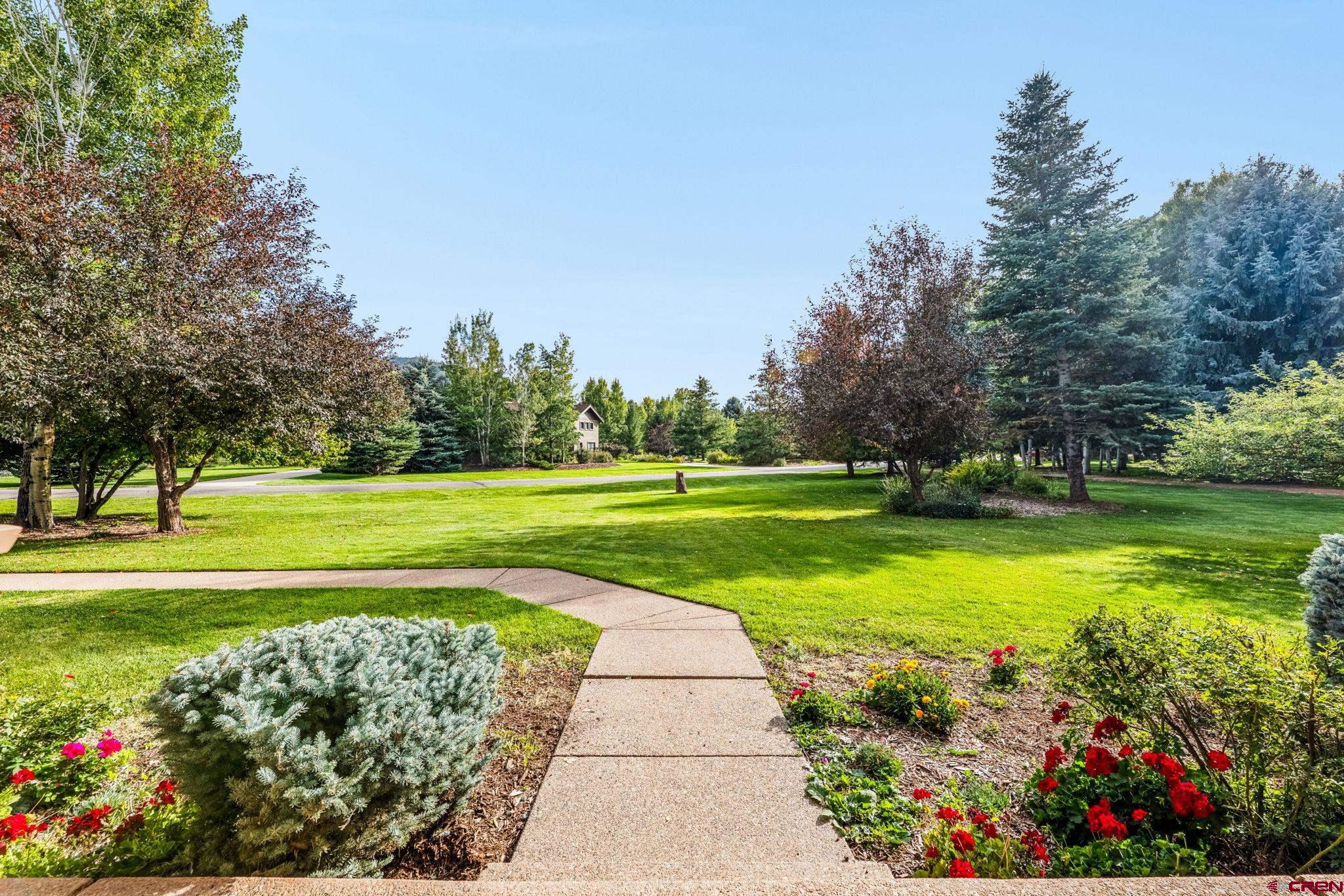 345 Red Rock Road Durango, CO 81301 - Photo 36 of 44 a view of a golf course with a lake view
