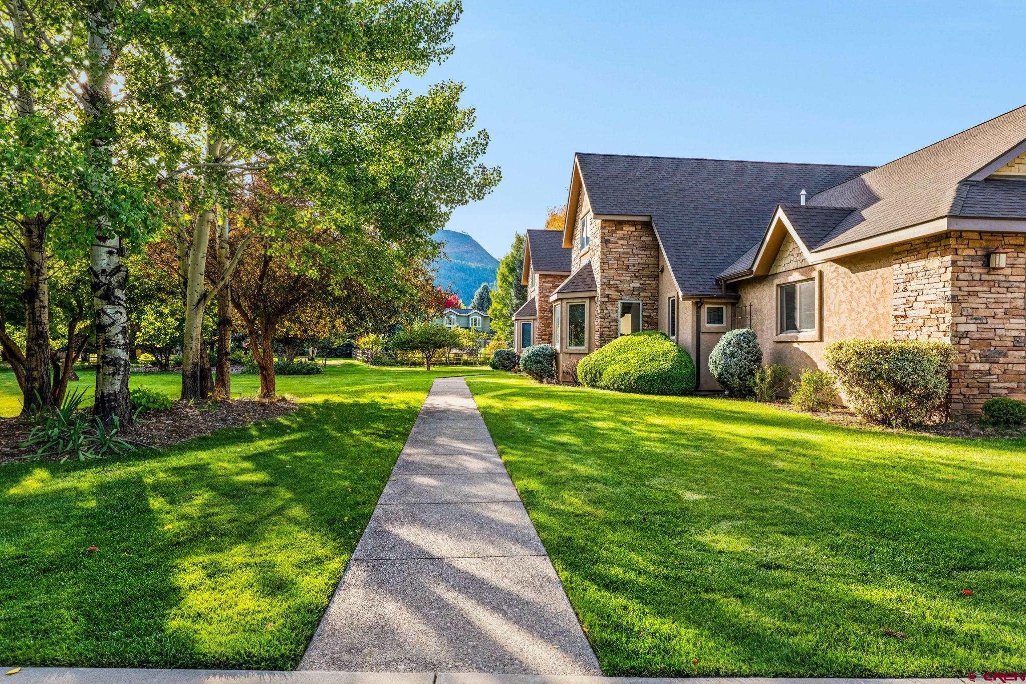 345 Red Rock Road Durango, CO 81301 - Photo 42 of 44 a front view of house with yard and green space