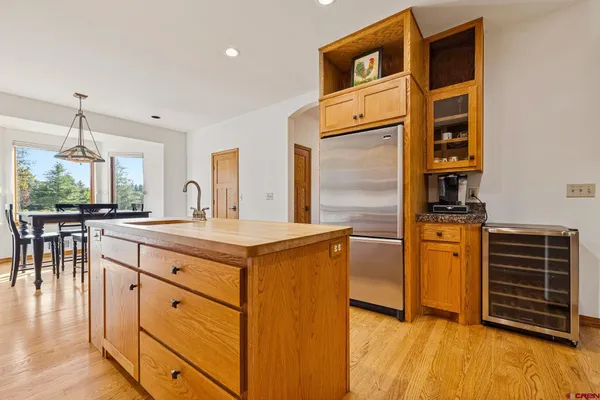 a kitchen with stainless steel appliances granite countertop a stove and a refrigerator