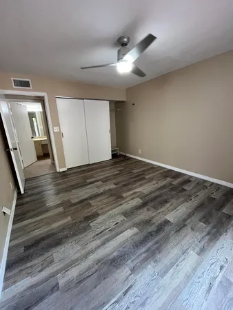 a view of a livingroom with wooden floor