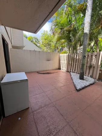 a view of backyard with tree