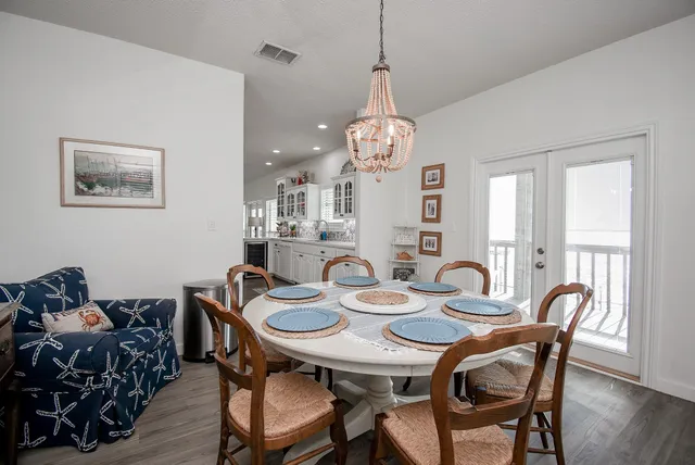 a kitchen with a sink and a large mirror