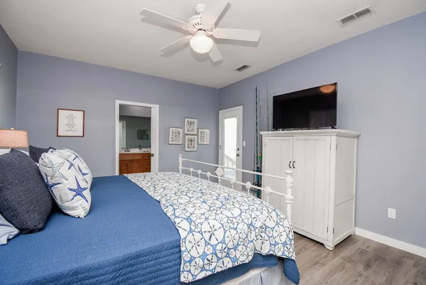 a bedroom with two beds and a window