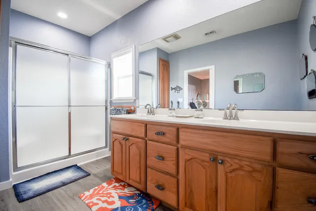 a bedroom with furniture and a lamp