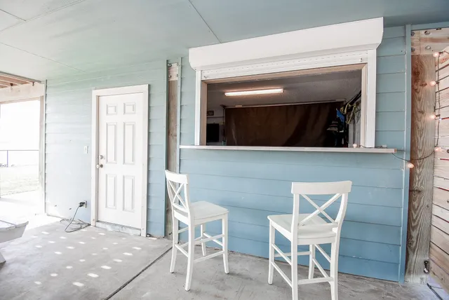 a front view of a building with garden