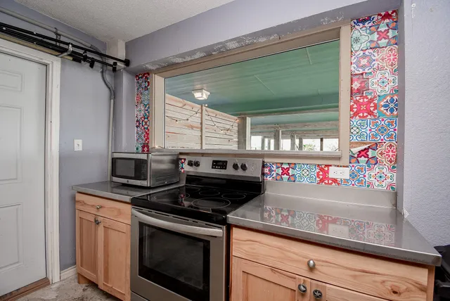 a view of an apartment with a swimming pool