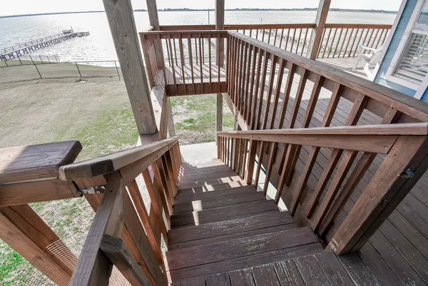 a view of balcony with wooden floor