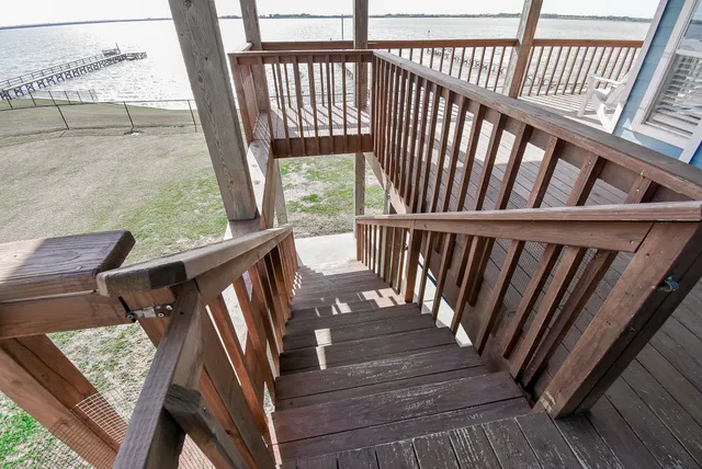 a view of balcony with wooden floor