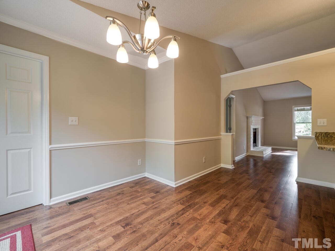 745 Brewer Circle Wake Forest, NC 27587 - Photo 17 of 43 a view of a livingroom with wooden floor