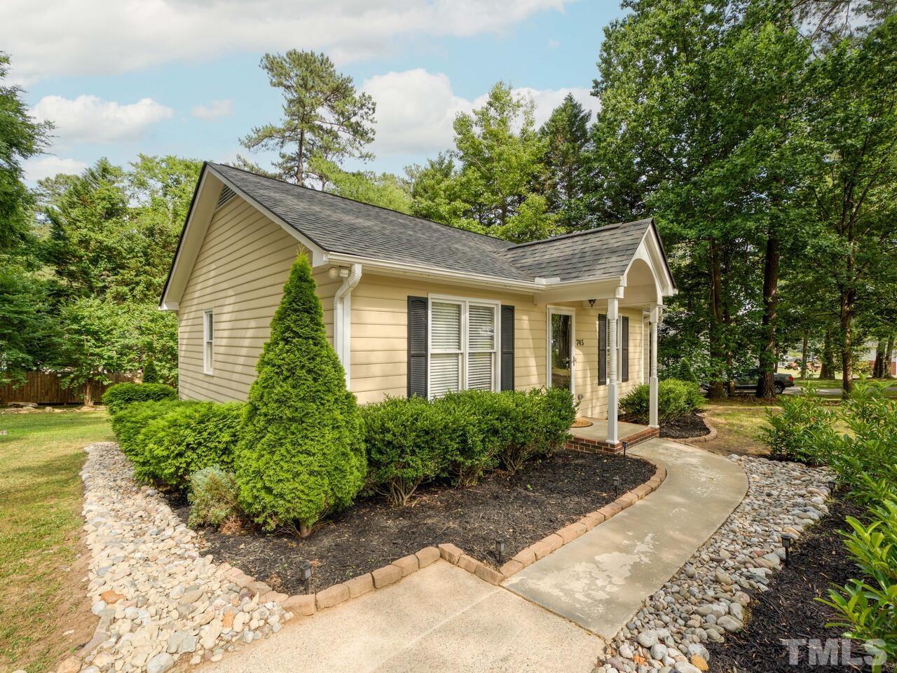 745 Brewer Circle Wake Forest, NC 27587 - Photo 2 of 43 a front view of a house with garden