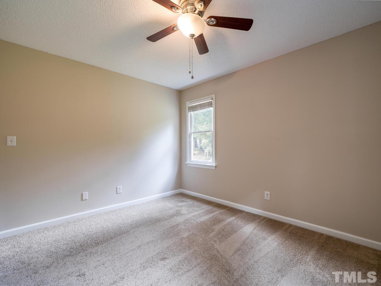 745 Brewer Circle Wake Forest, NC 27587 - Photo 21 of 43 an empty room with a window and a fan