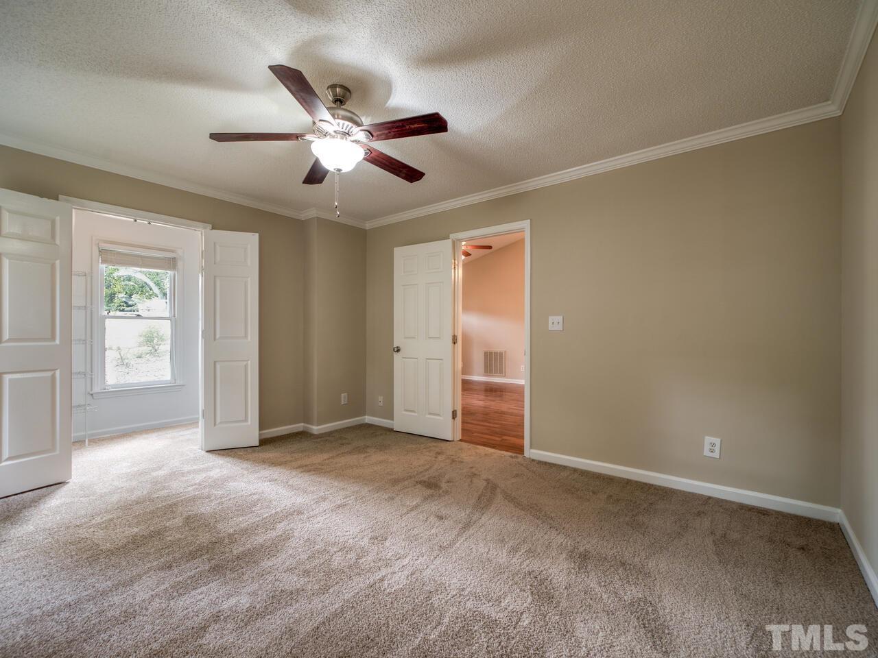 745 Brewer Circle Wake Forest, NC 27587 - Photo 29 of 43 an empty room with windows and fan