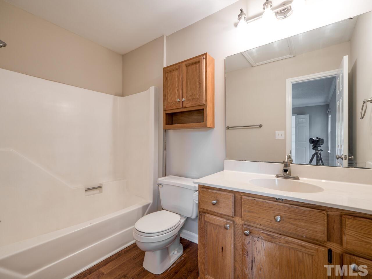 745 Brewer Circle Wake Forest, NC 27587 - Photo 32 of 43 a bathroom with a sink a toilet and shower