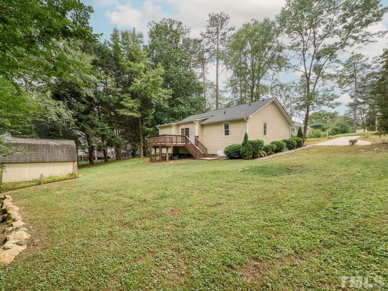 745 Brewer Circle Wake Forest, NC 27587 - Photo 37 of 43 a view of a house with a yard and garage