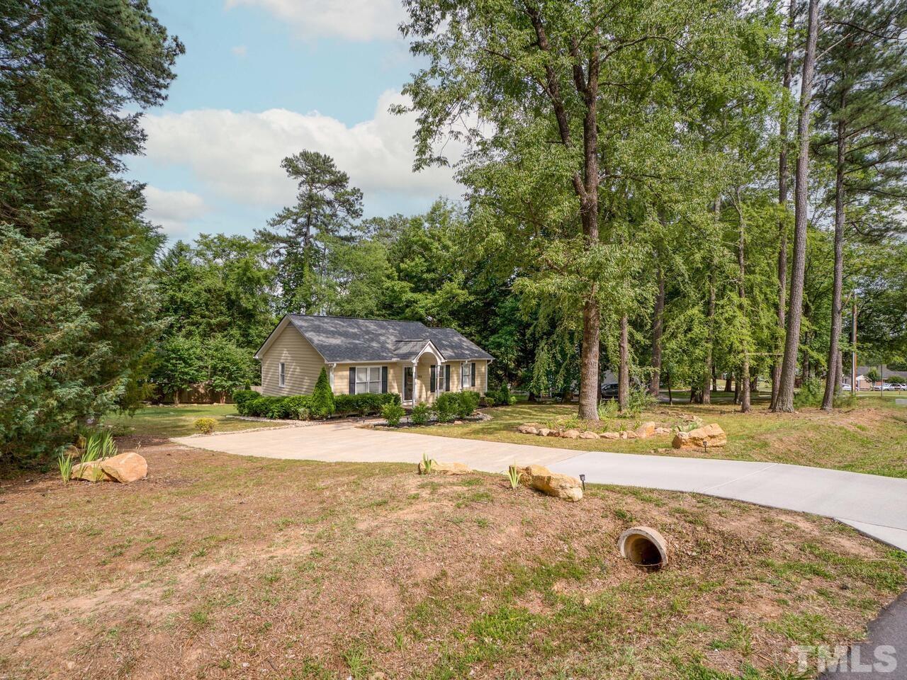 745 Brewer Circle Wake Forest, NC 27587 - Photo 41 of 43 a front view of a house with a yard and garage