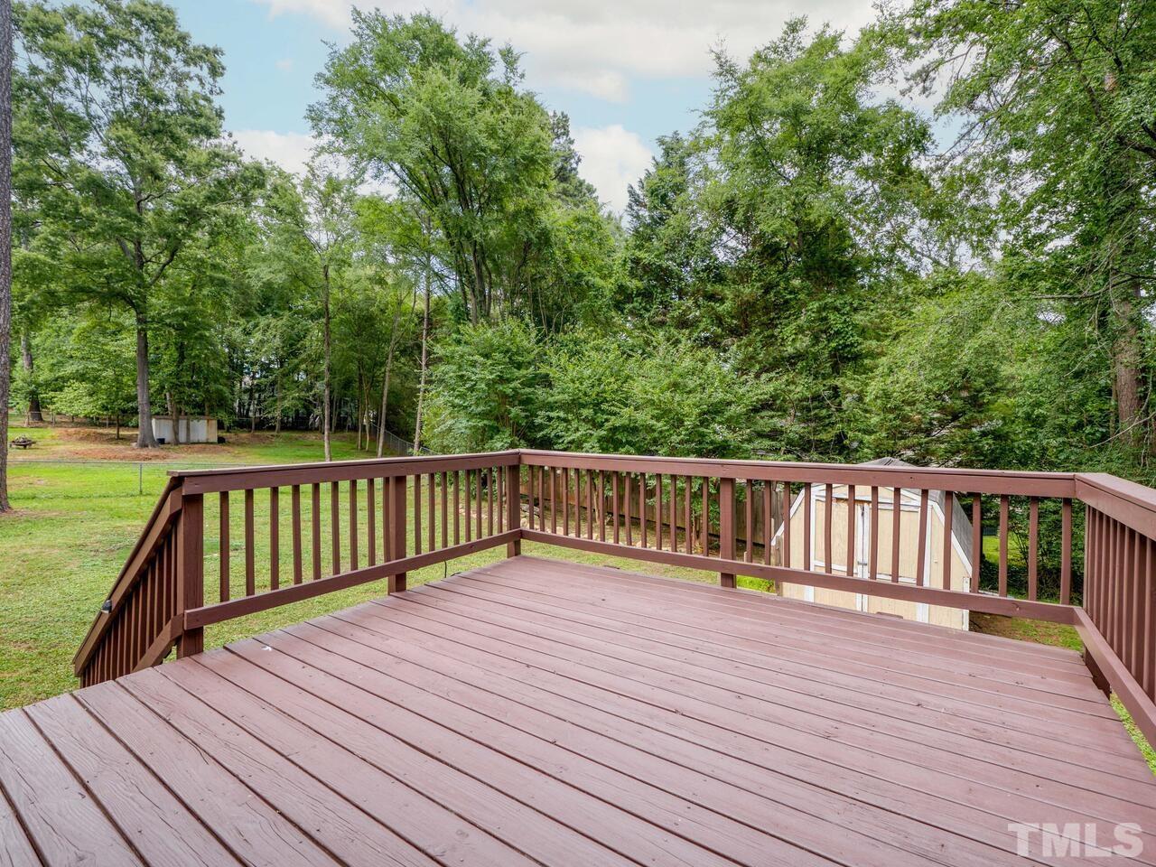 745 Brewer Circle Wake Forest, NC 27587 - Photo 5 of 43 a view of balcony with wooden floor and fence