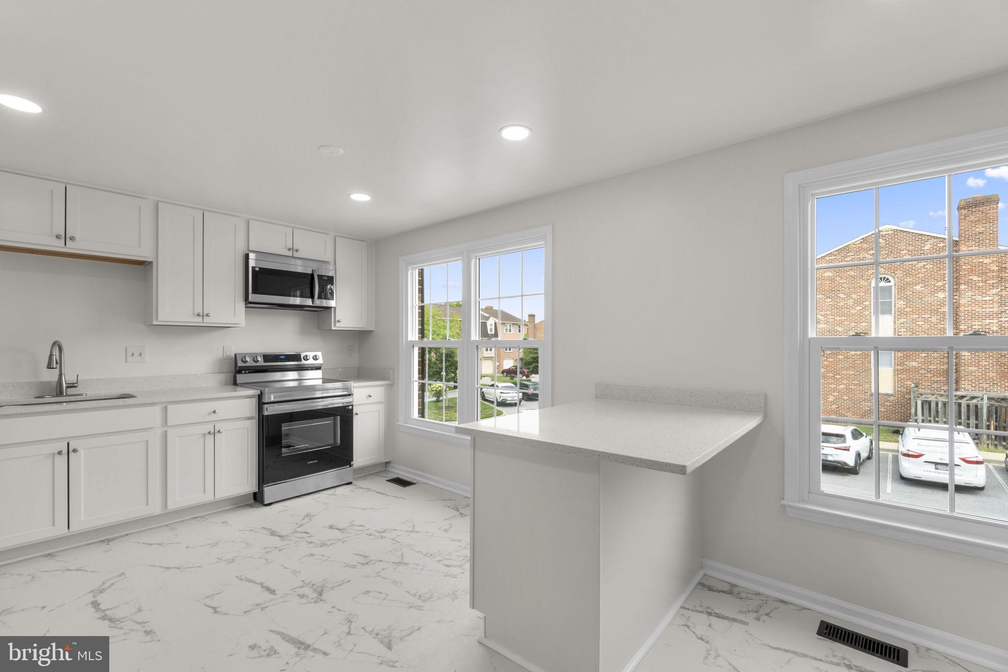 8039 Hollow Reed Court Frederick, MD 21701 - Photo 3 of 28 Bright and airy modern kitchen space.